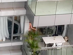 Neighbor spied topless in balcony